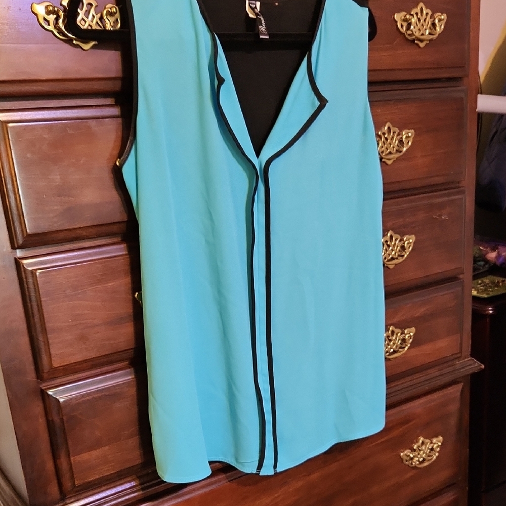 Elegant Sleeveless Turquoise Blouse with Black Trim